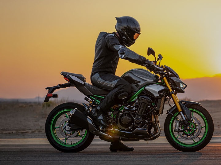 Rider on a Kawasaki Z900 at sunset